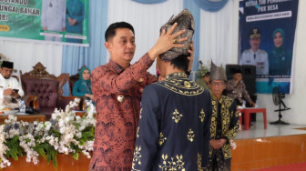 PJ Bupati Muaro Jambi Kukuhkan Datuk Penghulu LAM Jambi Desa Marga Mulya